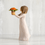 Thumbnail: Willow tree gril holding pot of flowers side view