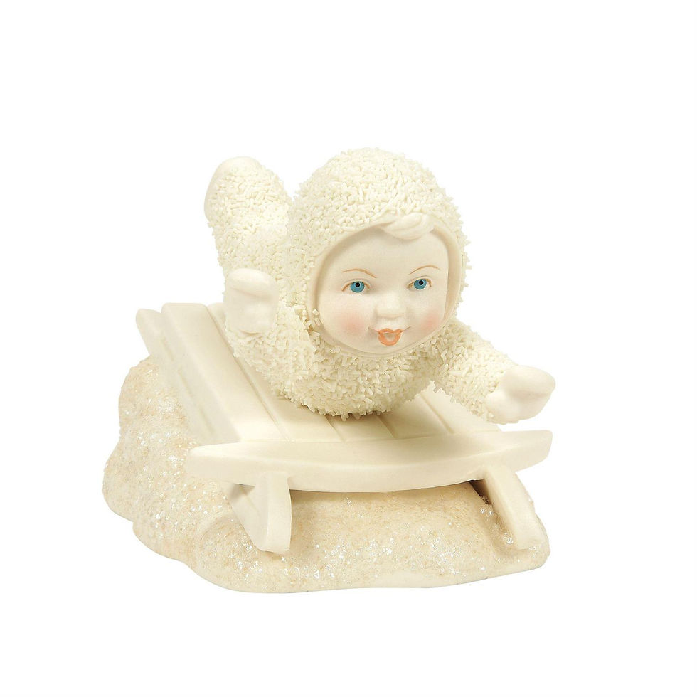 snowbaby sledding figurine front view