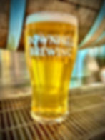 This is either an image of a pint glass filled with the craft beer along with a hand drawn character specific for that brew or, it's the Downhill Brewing logo if there isn't a photo of the brew in a pint glass available.