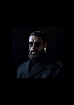 fake men wearing EARRING