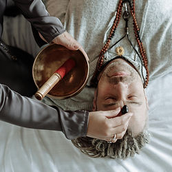 Practitioner using a singing bowl for online angelic healing ireland.