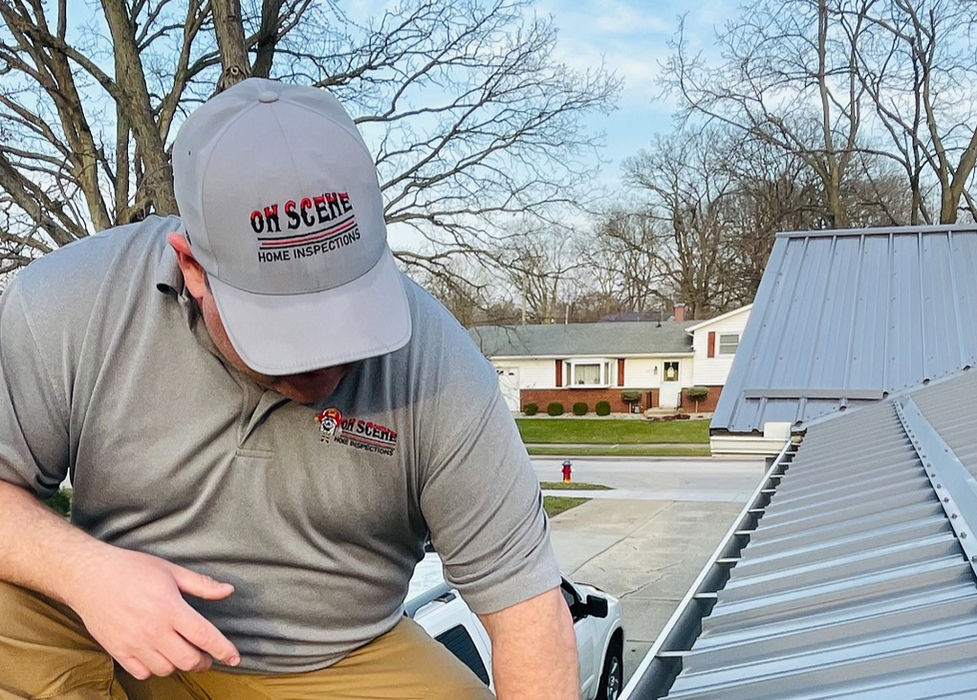 Home Inspector looking at gutters