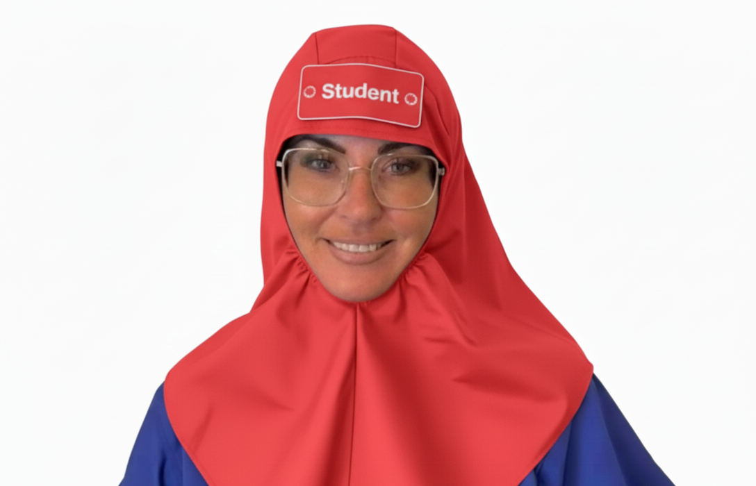 A Student wearing Eco Ninjas name and role badge hat, Hijab style