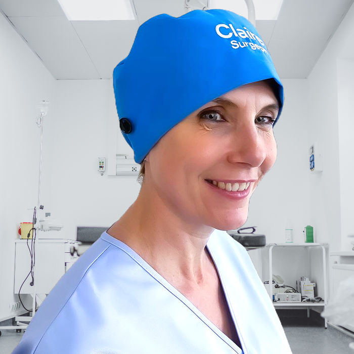 A nurse wearing an Eco Ninjas Blue embroidered elastic back hat