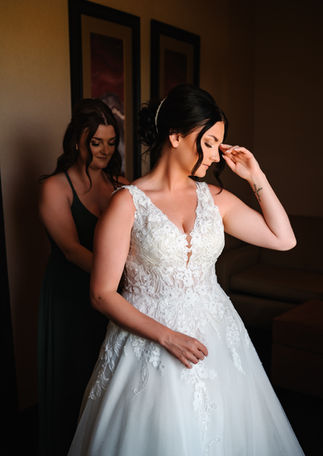 Bride getting ready at Days Inn Innisfail before her Markerville Alberta wedding