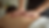 Close-up view of a massage therapist’s hands gently working on a client’s back