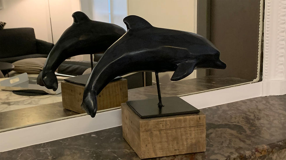Matt, sculpture en bois représentant des dauphins, réalisée par LAURENT en 2019.
