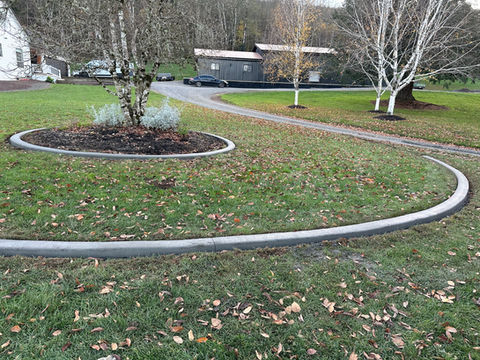 Installing concrete yard trim and edging by Tyeco Services, creating clean and durable borders for landscaping in Vancouver, WA & Portland, OR