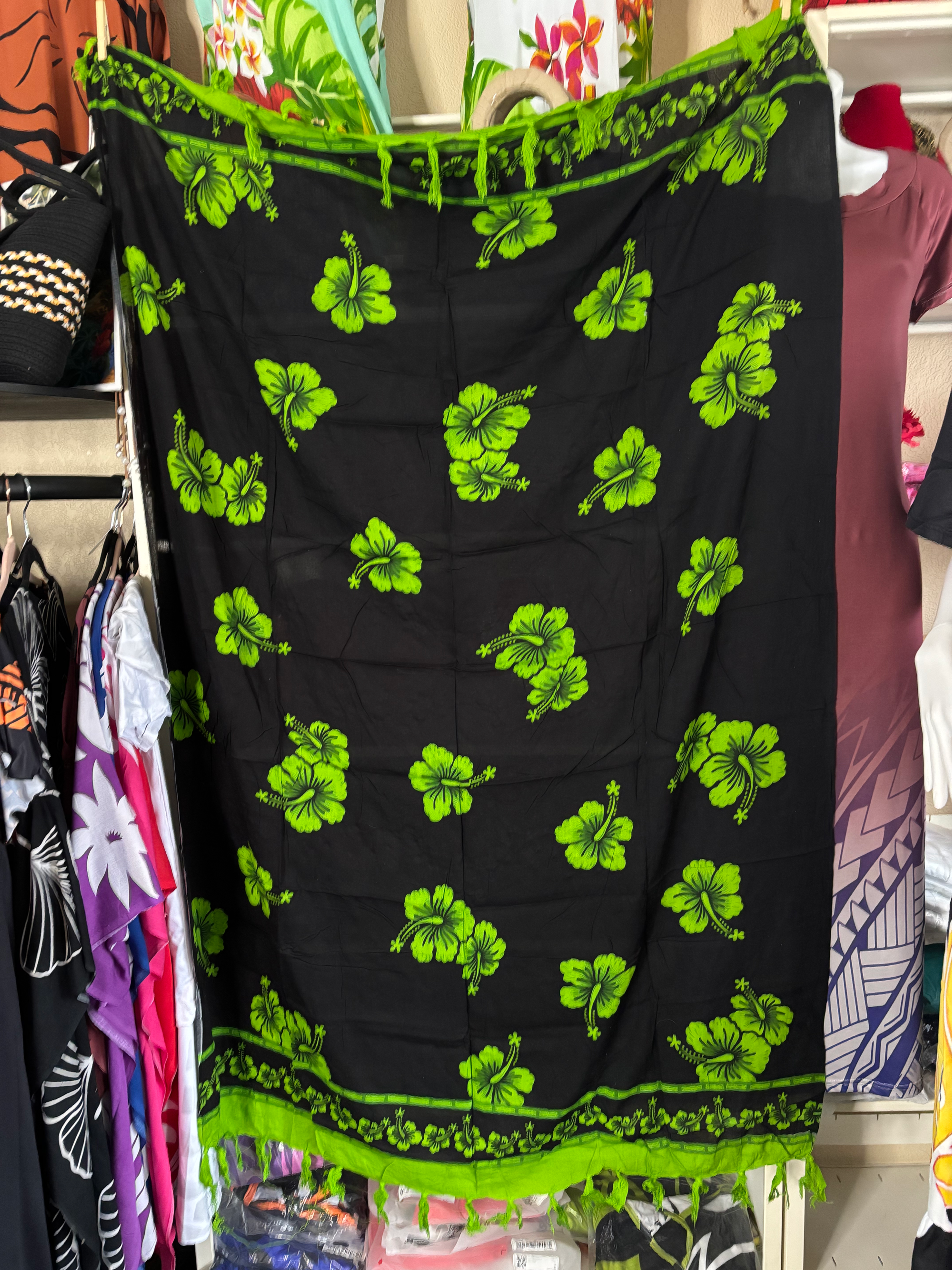 Hibiscus (Aute) Design Sarongs with fringes .