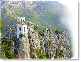 White bell tower in Guadalest