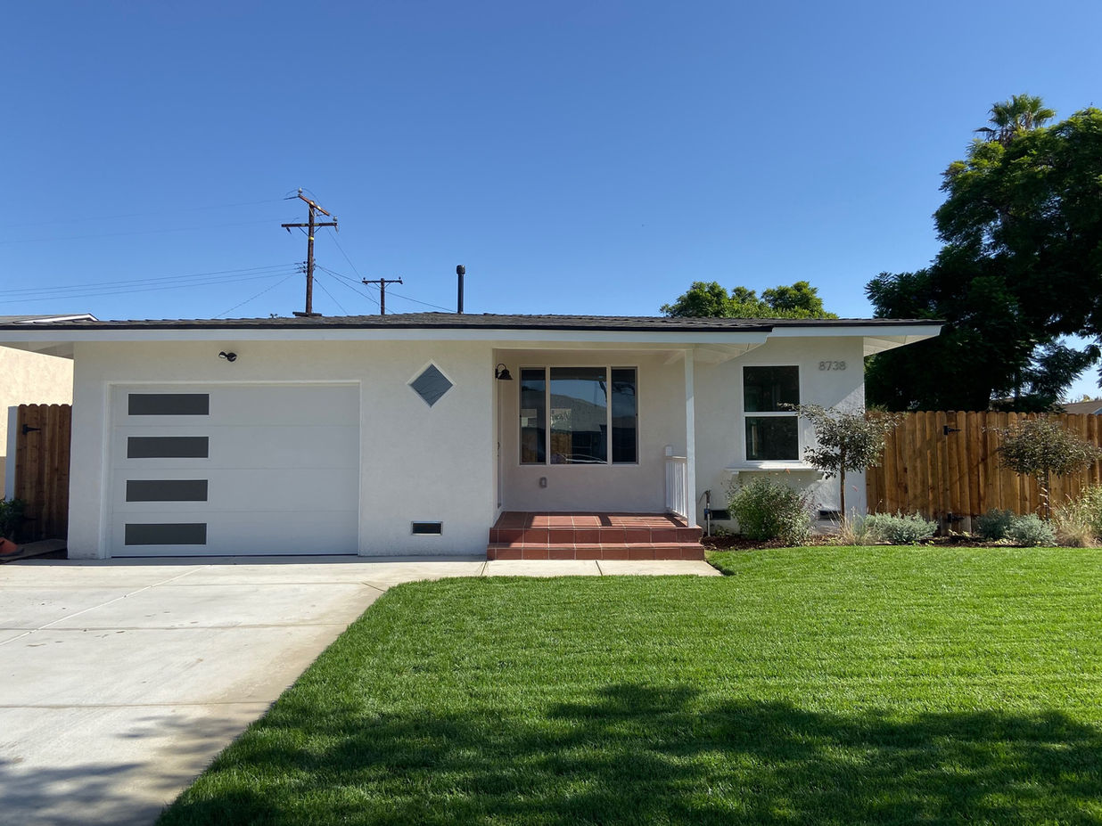 Modern Home with fresh cut grass in the front yard
