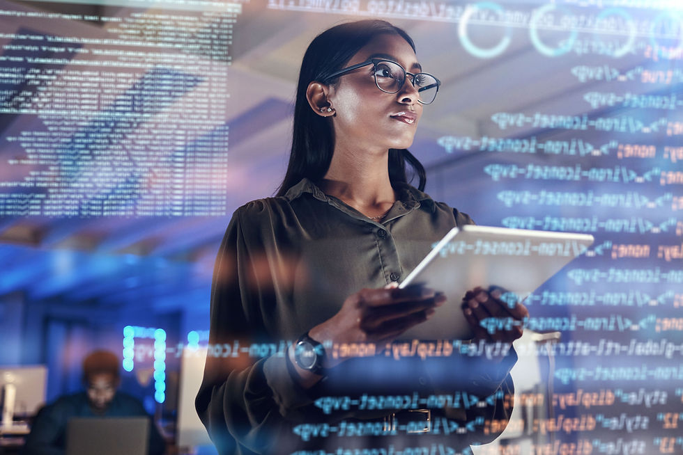 A woman holding a laptop, working on IT coding tasks.