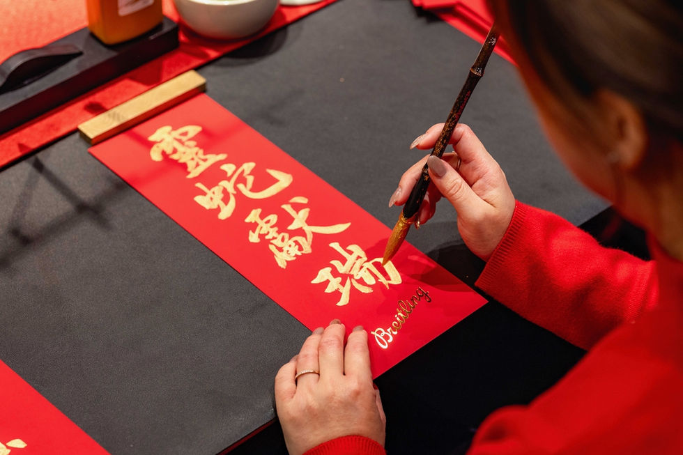 Onsite Chinese calligraphy on festive couplets for luxury brand