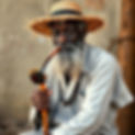 black man papa legba with cane, straw hat, pipe, .jpg