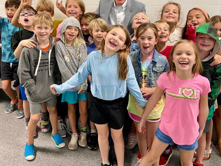 Second Graders Swarm Superintendent Arnett
