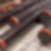Create a realistic, high-quality image showcasing Alloy and Carbon Steels. Feature real te