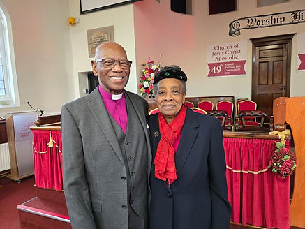Bishop and Pastor Richards Pink Clergy and Red Scarf.jpg
