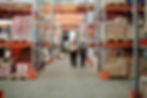 warehouse staff using printed labels to organise stock