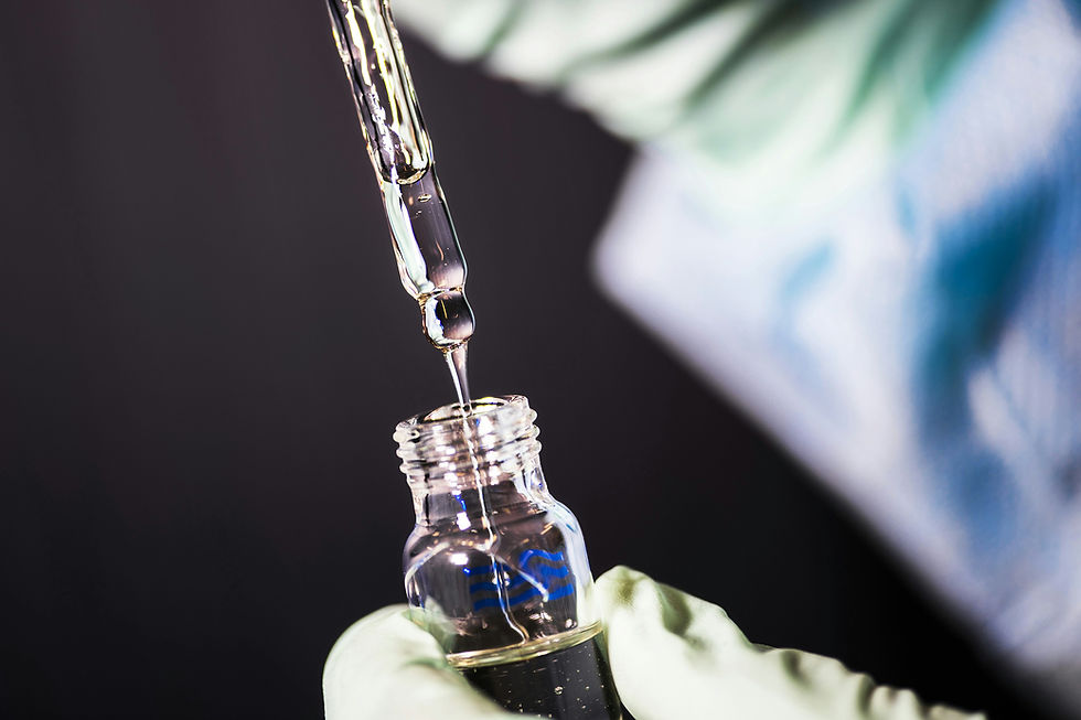 A syringe drawing from a small, single unit dose vial