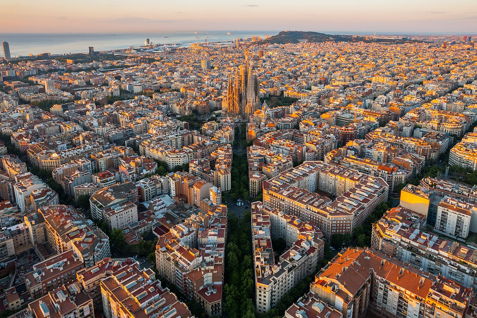 Aerial view of Barcelona Eixample residential district and Sagrada Família Basilica at sun