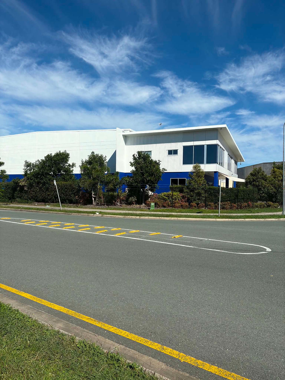 A pristine architectural facade of a completed commercial building project, showcasing clean lines and uniform protective coating application