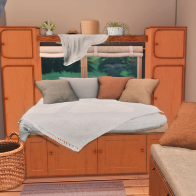 Cozy campervan interior filled with Campervan Living set: a neatly made nap bed with pillows, sheet, and throw blanket, a small sofa with pillows, wooden cupboard, woven wicker shelf and storage boxes, rugs, linen curtains, hanging blanket, pampas grass bouquet, string of pearls plant, and raffia hat, creating a warm and lived-in tiny van space.