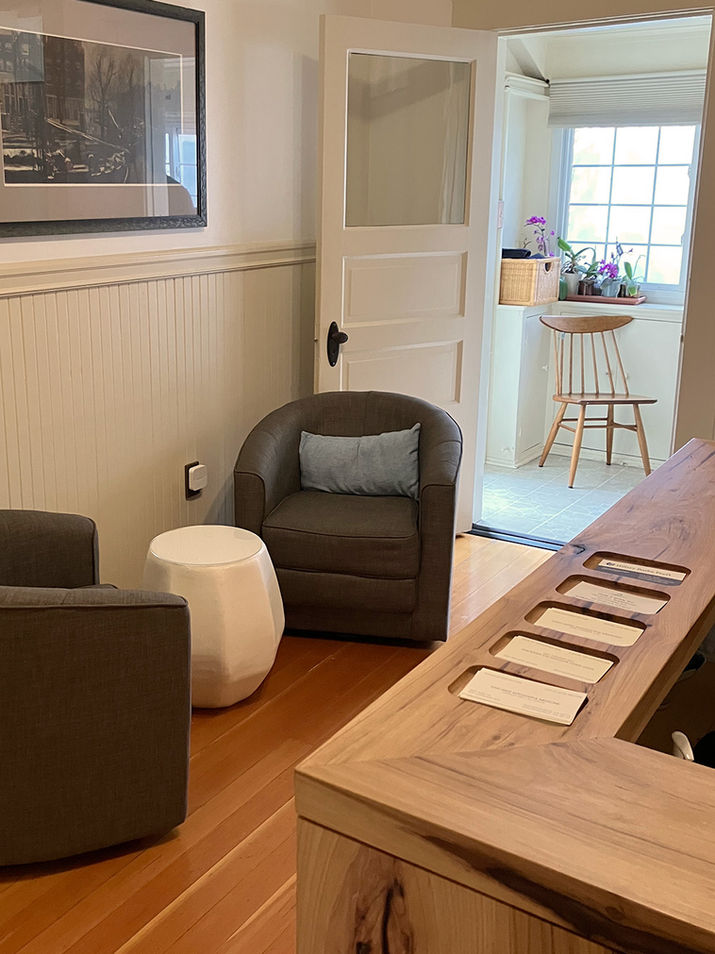 Bernal Heights clinic includes a wooden reception desk and comfortable chairs.