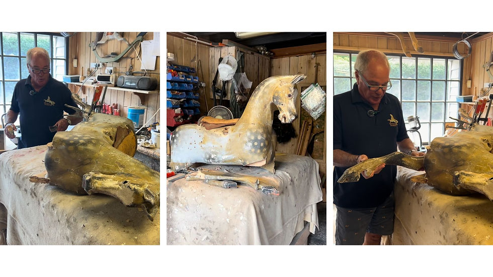 Marc in the rocking horse hospital with a 100 year old Lines Brothers rocking horse ready to be restored