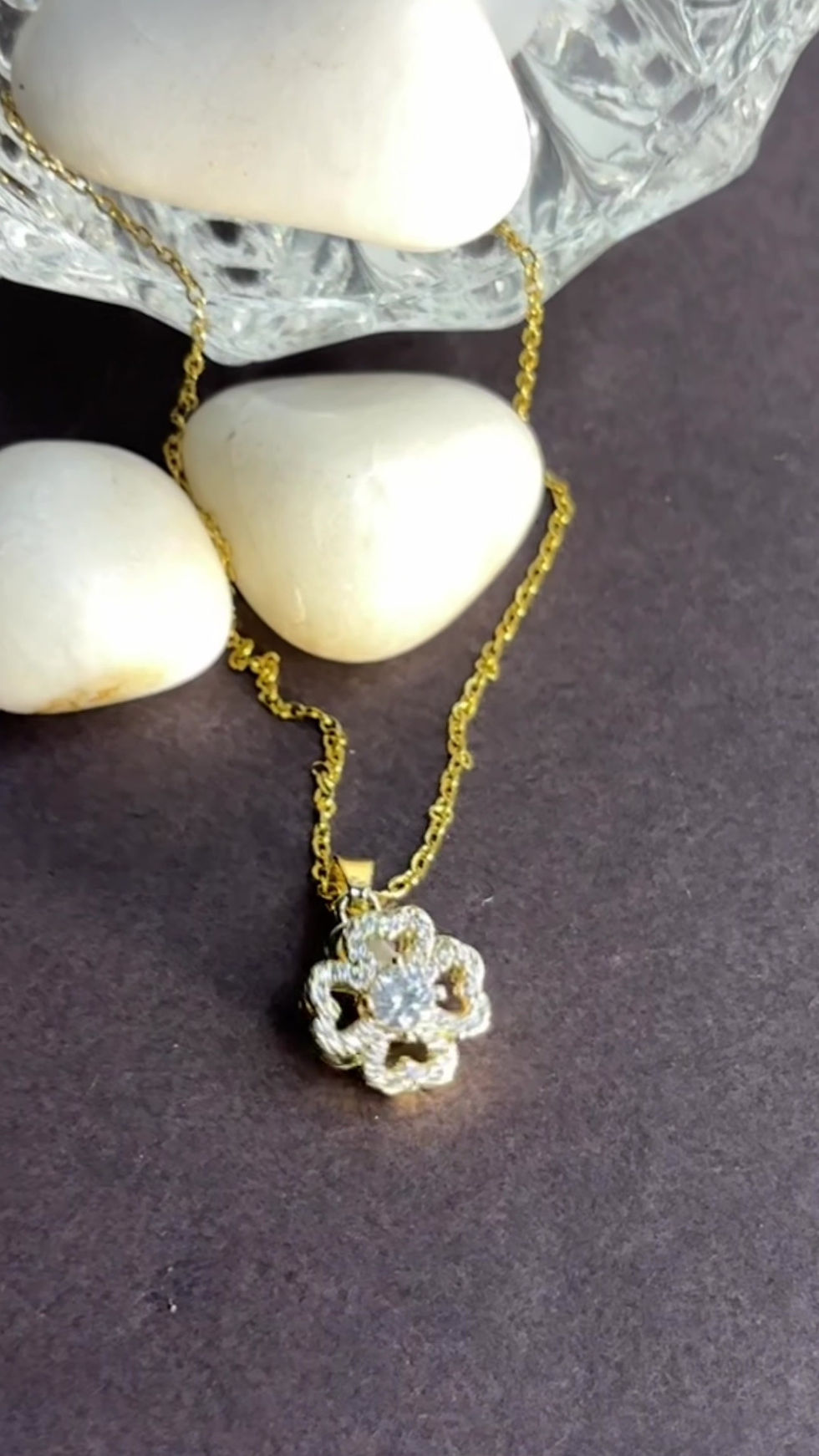 Thumbnail: GOLDEN ROTATING FLOWER NECKLACE