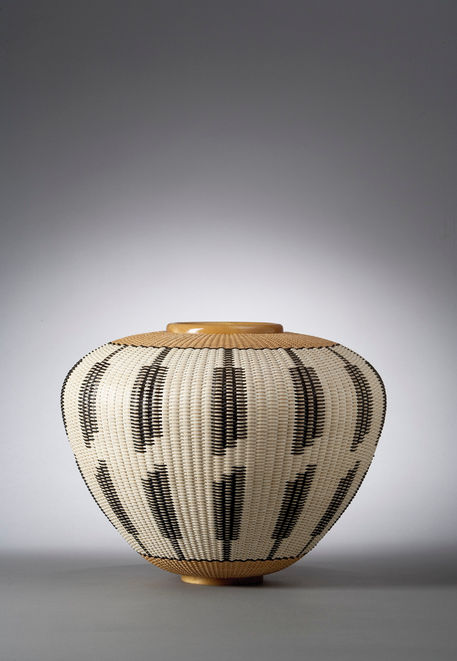 Large vessel basket with feather pattern motif open top traditional basket weaving techniques