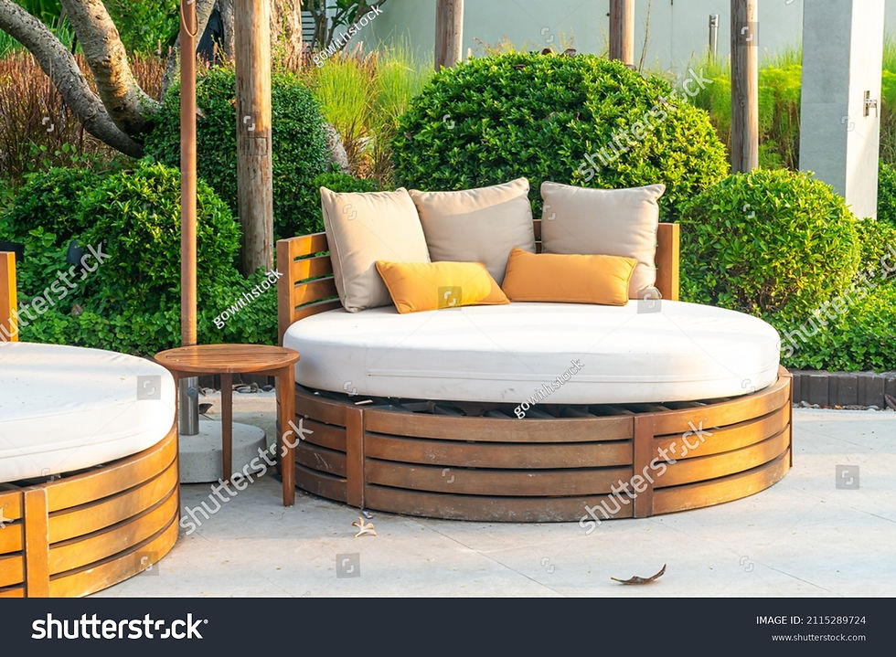 stock-photo-pillows-on-outdoor-patio-chair-with-umbrella-in-garden-2115289724