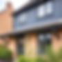 landscape of modern UK house with dark grey soffit and fascia and guttering.jpg
