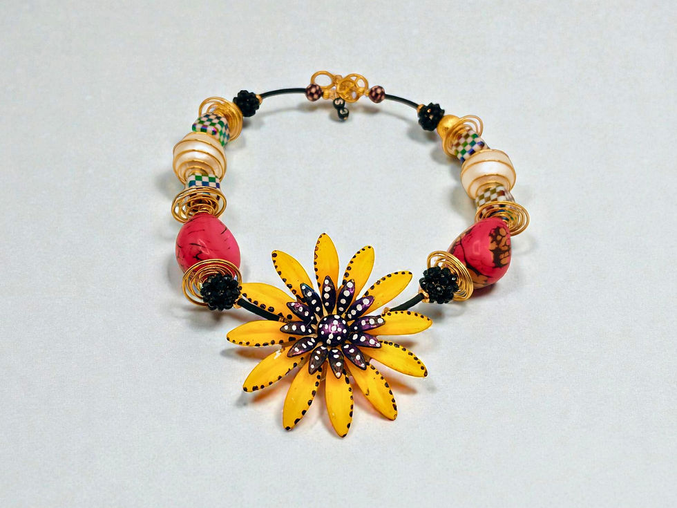 Thumbnail: Yellow flower necklace with red beads and gold detailing on white background