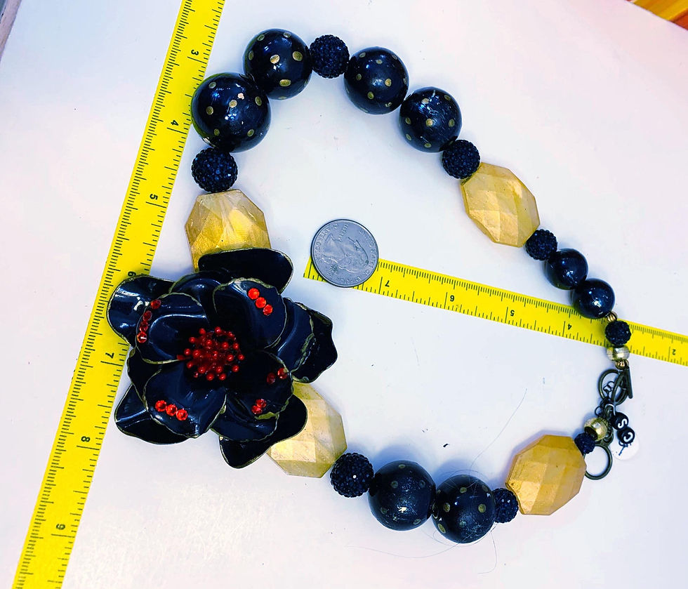 Thumbnail: Floral design necklace with beads and gold accents, next to a ruler