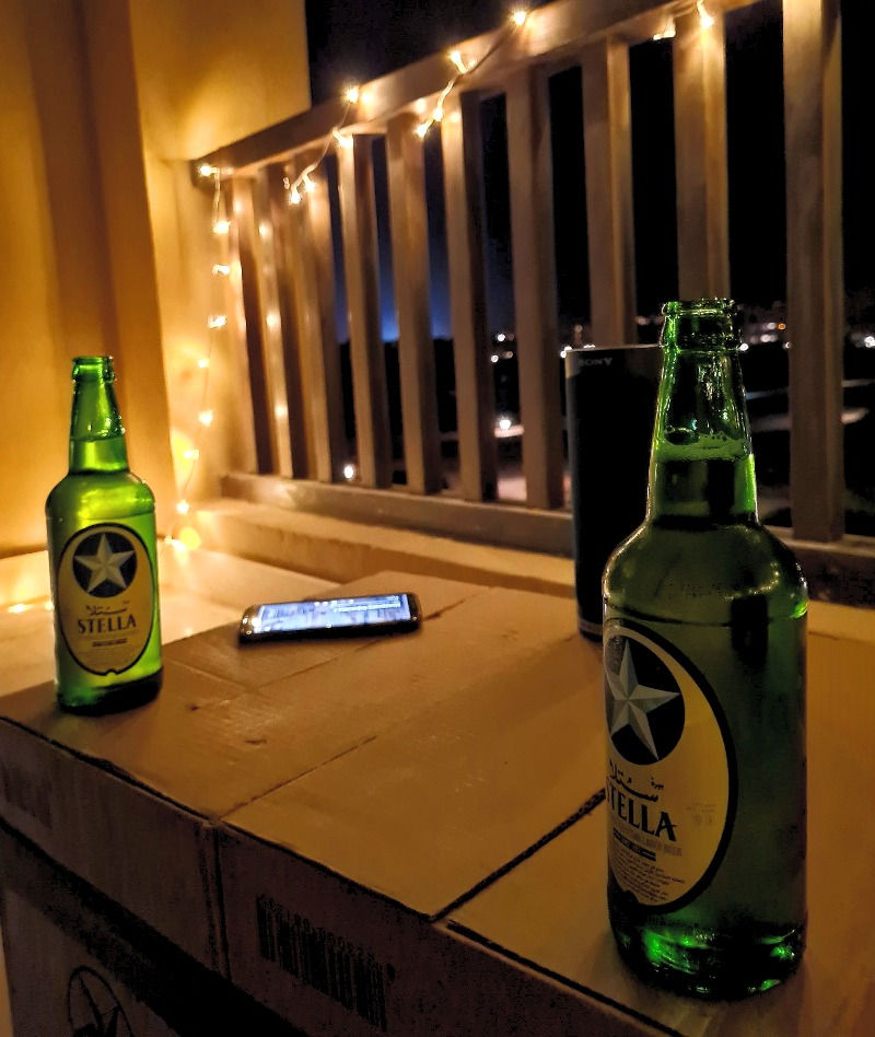 Beers on the balcony with fairy lights