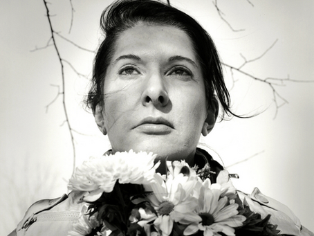Marina Abramović, Portrait with Flowers (2009). Gelatin silver print; photo: © Marco Anelli.