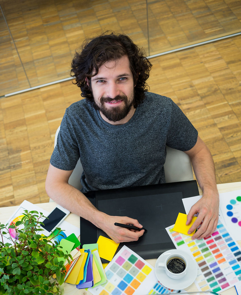 male-graphic-designer-using-graphics-tablet_edited.jpg