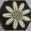 Thumbnail: Hexagonal tile with nine petal flower