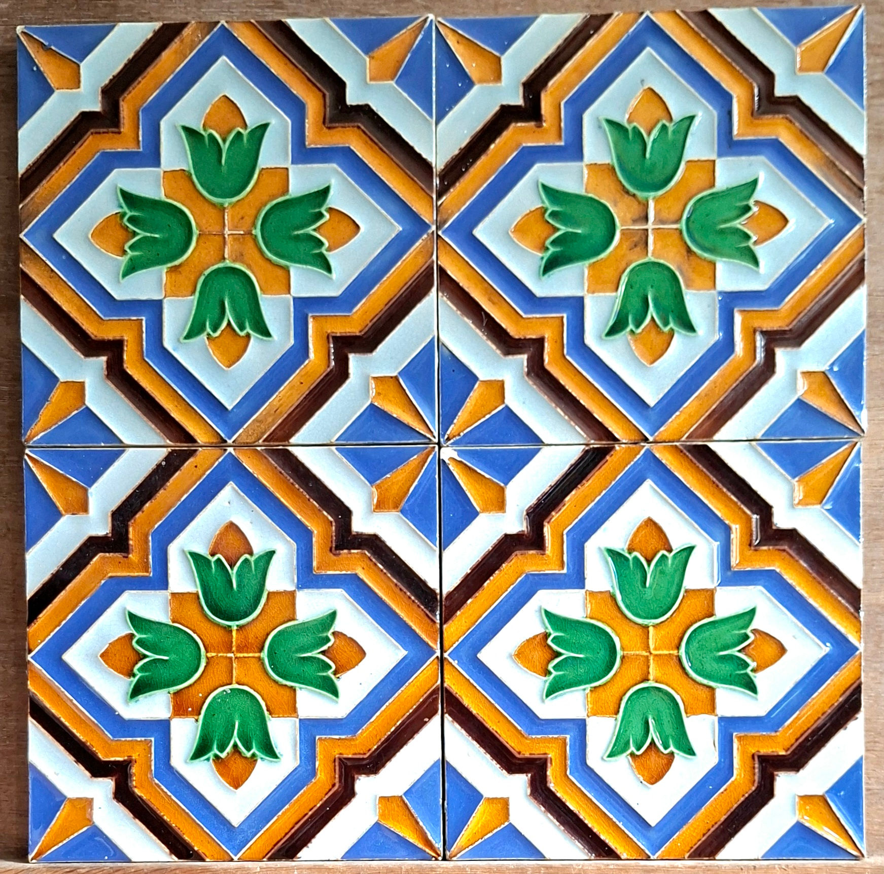 Four Spanish Arista-style majolica tiles by Maw & Co
