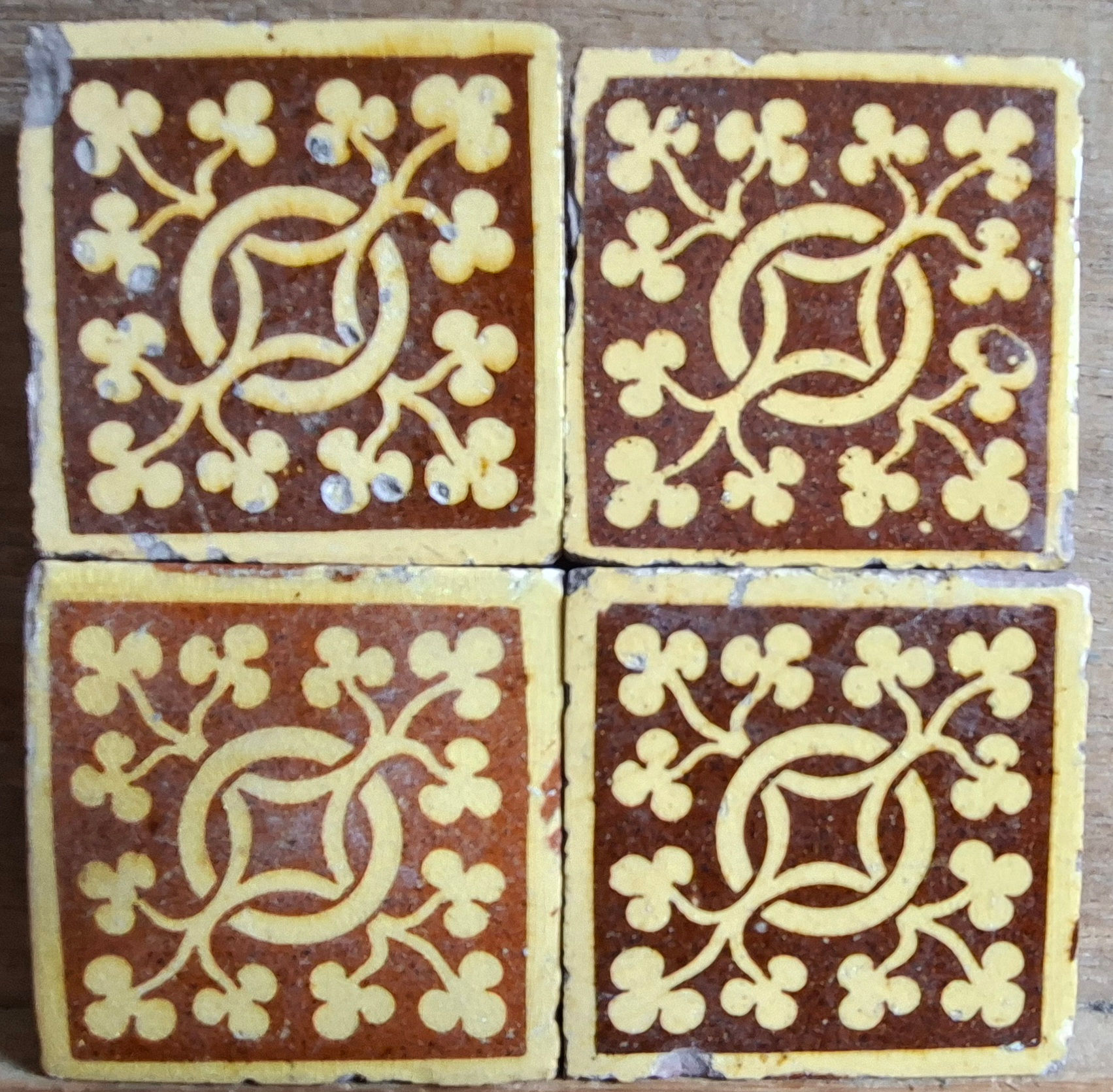 Four small Chamberlain floor tiles