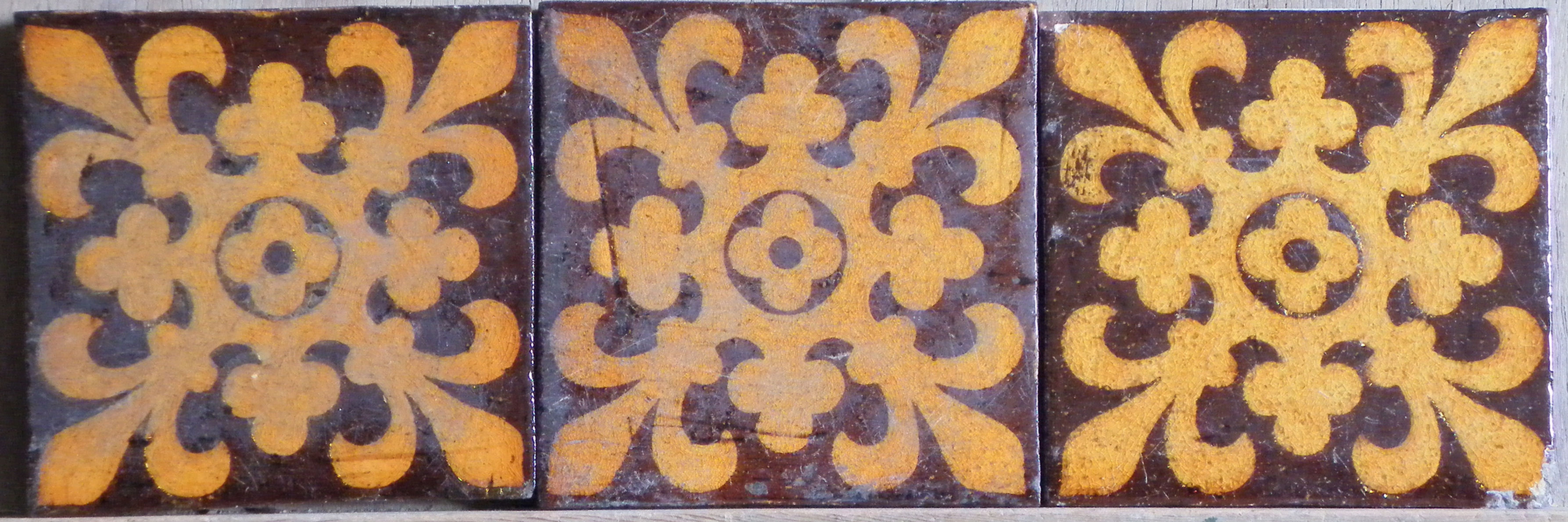 Three ordinal floral cross with fleur de lys and trefoils