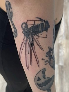 Freddy Kruger glove tattoo designed and tattooed by Breanna
