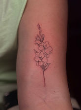 Fine Line flower tattoo designed and tattooed by Ocala Florida tattoo artist Comet at Stranger Flowers Yet Tattoo in Belleview Florida