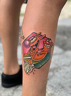 Custom CatDog cartoon character tattoo with bold color by Tyler in Ocala, FL