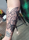 Black and Grey monstera leaves tattoo designed and tattooed by Ocala florida tattoo artist Aubrey at The Tattoo Gallery of Ocala in Ocala Florida