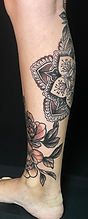 Custom mandala and floral leg tattoo creatd by Ocala Florida tattoo arist Gregg at The Tattoo Gallery of Ocala