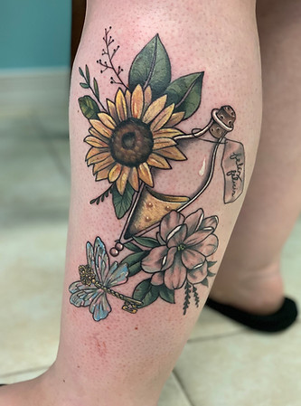 Harry Potter sunflower and potion bottle designed and tattooed by Gregg