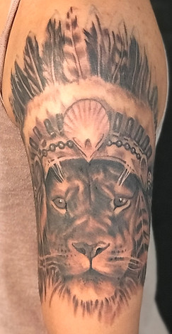 Black and grey realism lion tattoo designed and tattooed by Gregg
