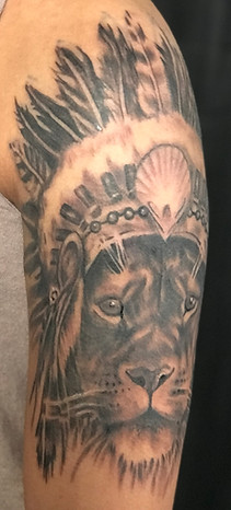 Black and grey realism lion tattoo designed and tattooed by Gregg