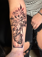 Soft black & grey heart in a jar tattoo designed and tattooed by ocala florida tattoo artist Breanna at The Tattoo Gallery 